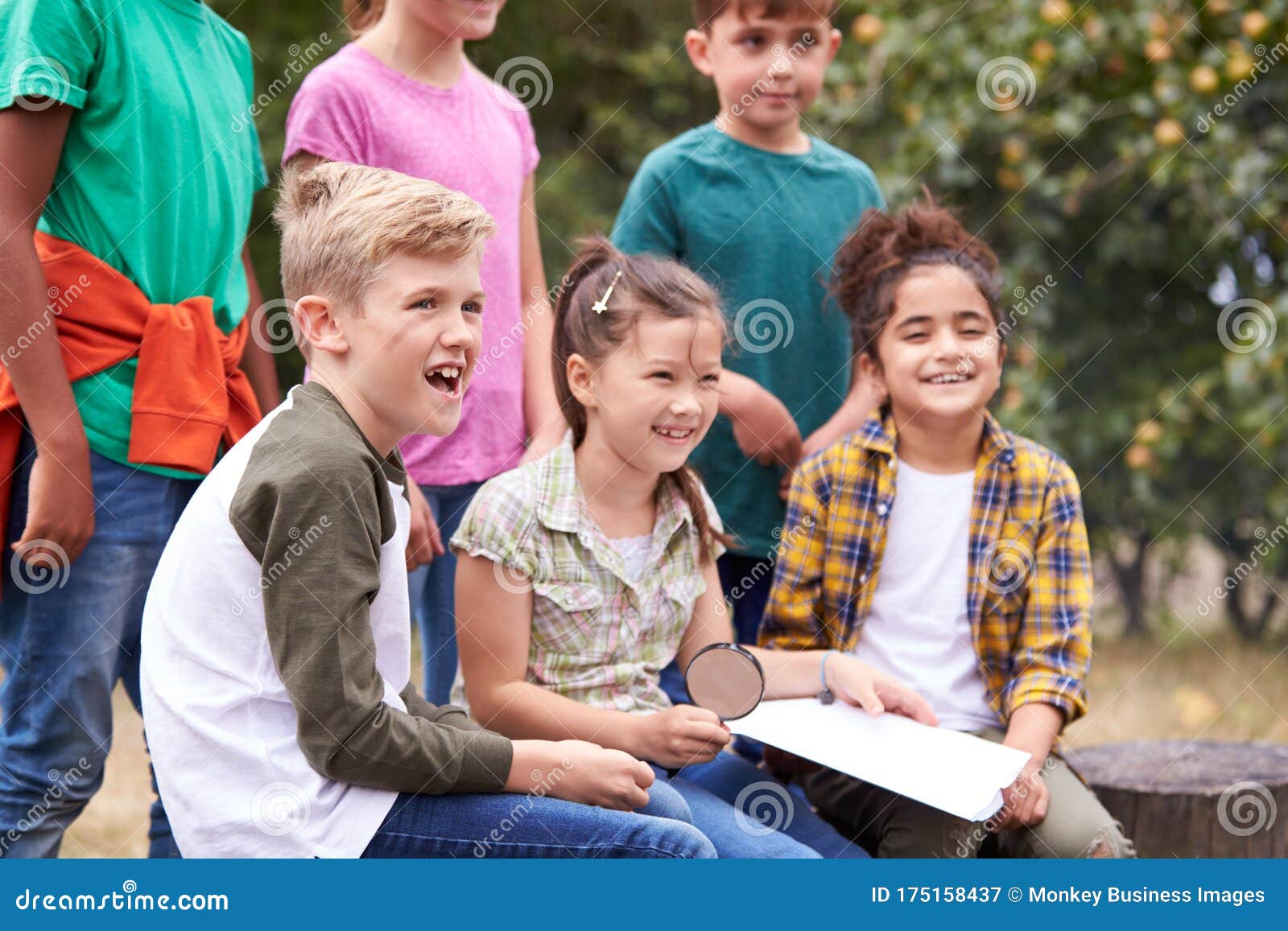 Group of Children on Outdoor Activity Camping Trip Looking at Map
