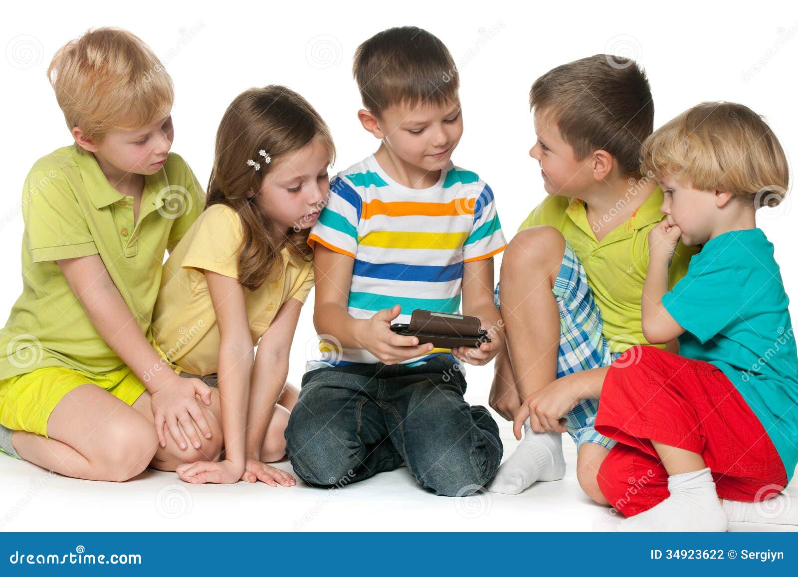 group children plaing with a new gadget