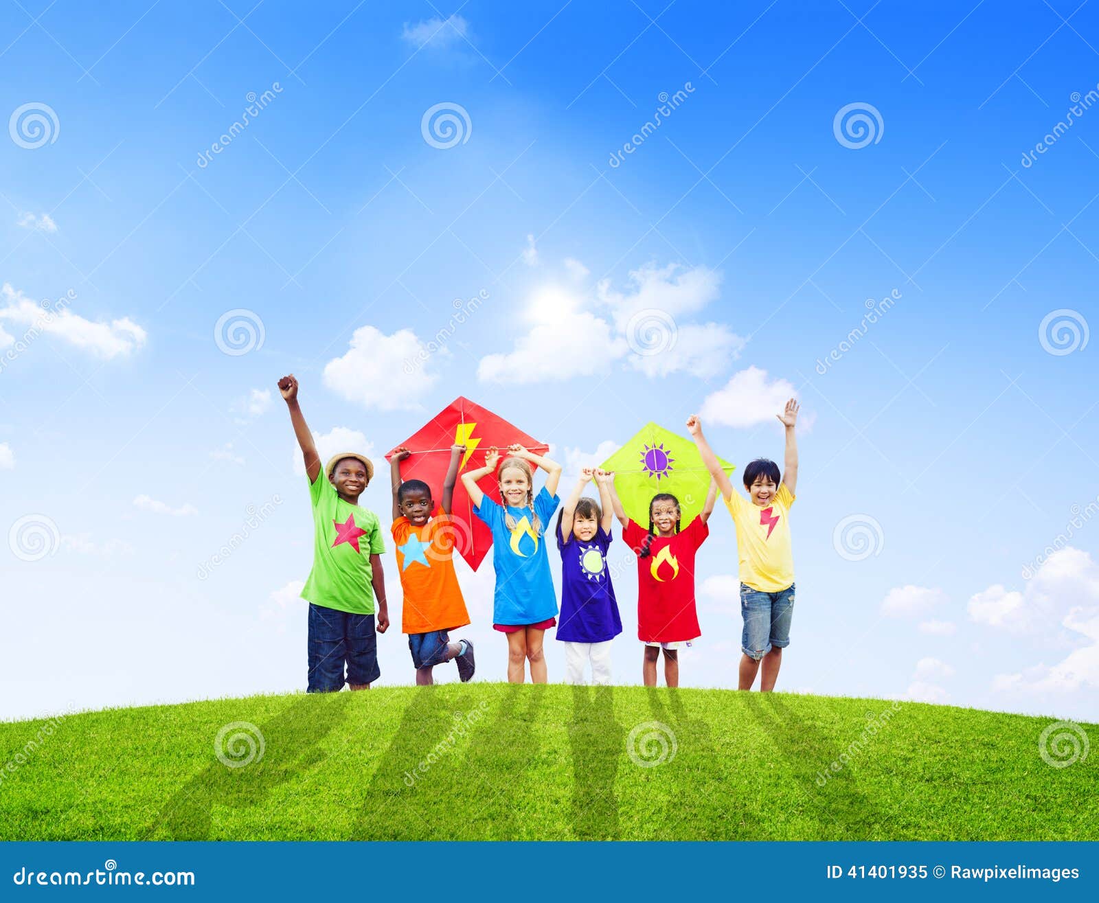 group of children playing kites together