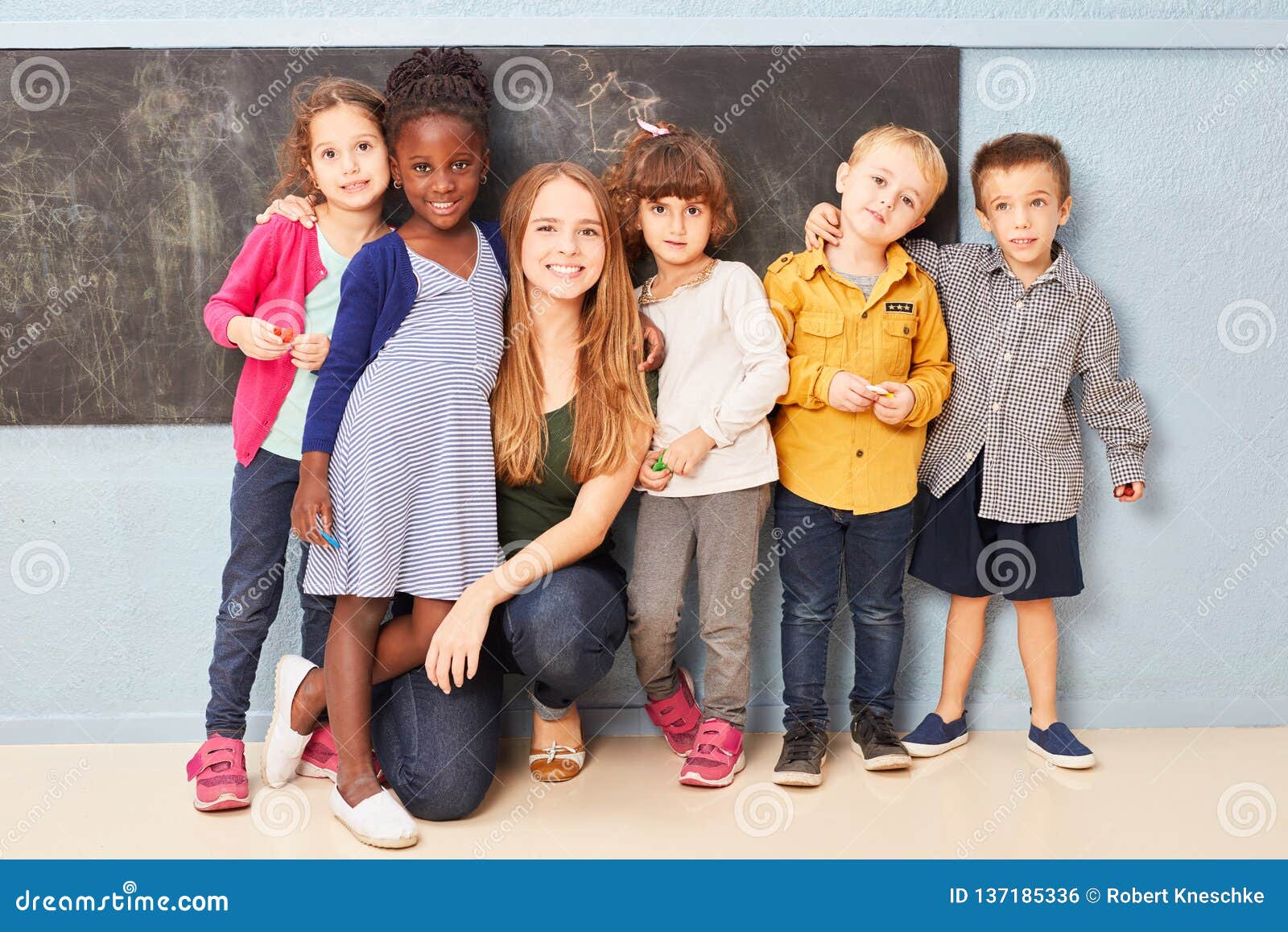 Group Of Children And Teacher As Friends Stock Photo