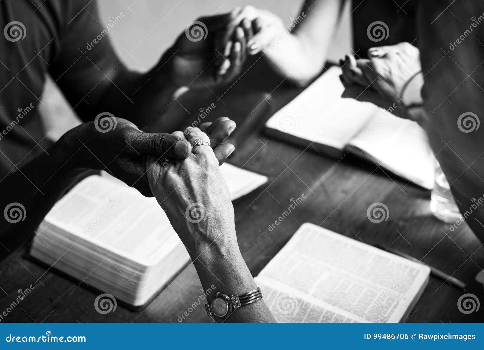 group of christian people are praying together