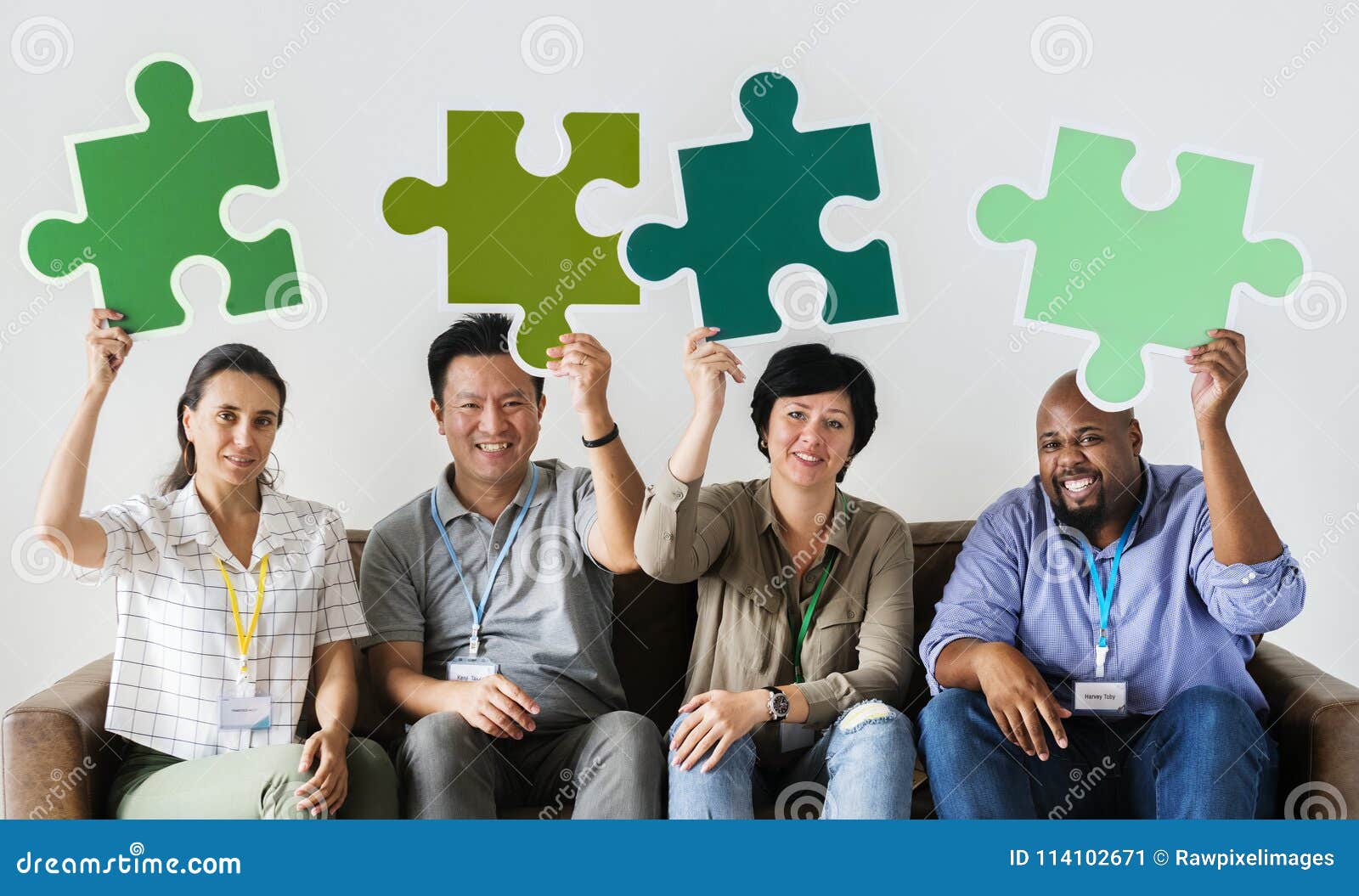  Group  Of Co workers  Holding Puzzle Icons  Stock Image 