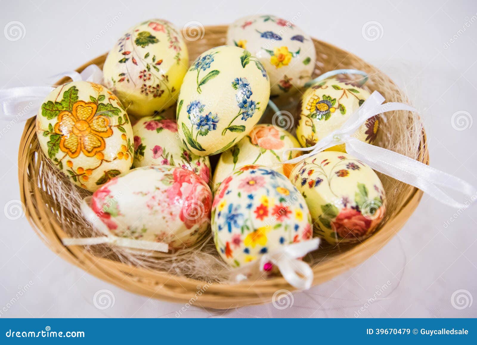 Group of Colorful Easter Eggs Decorated with Flowers Made by Decoupage Technique, in a Basket