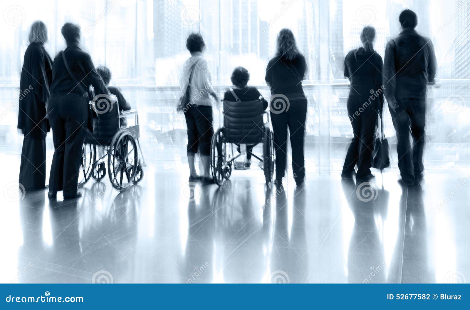 group and disabled people in the lobby business center