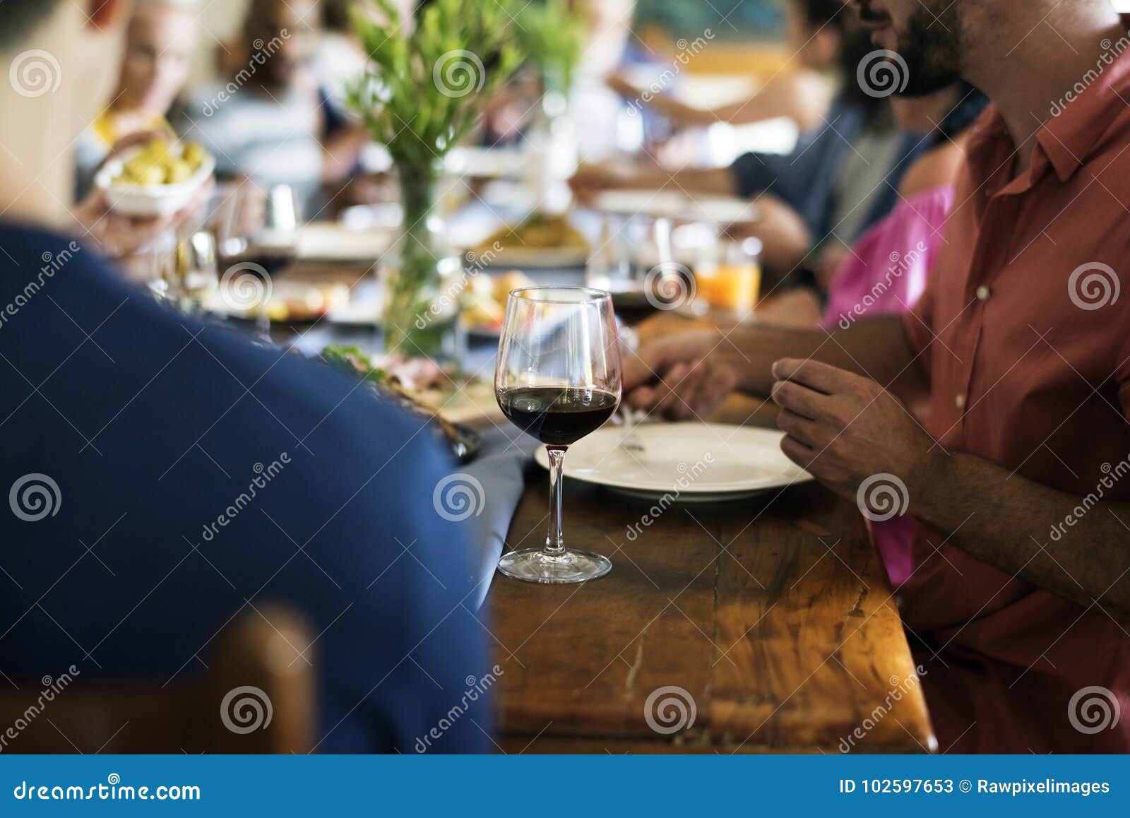 group of diverse friends are having a dinner together