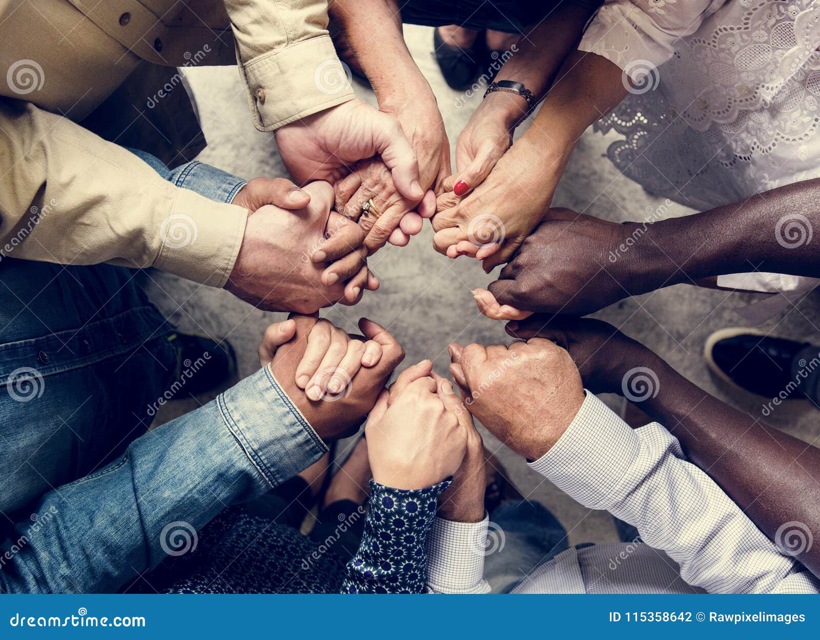 group of diverse hands holding each other support together teamwork aerial view