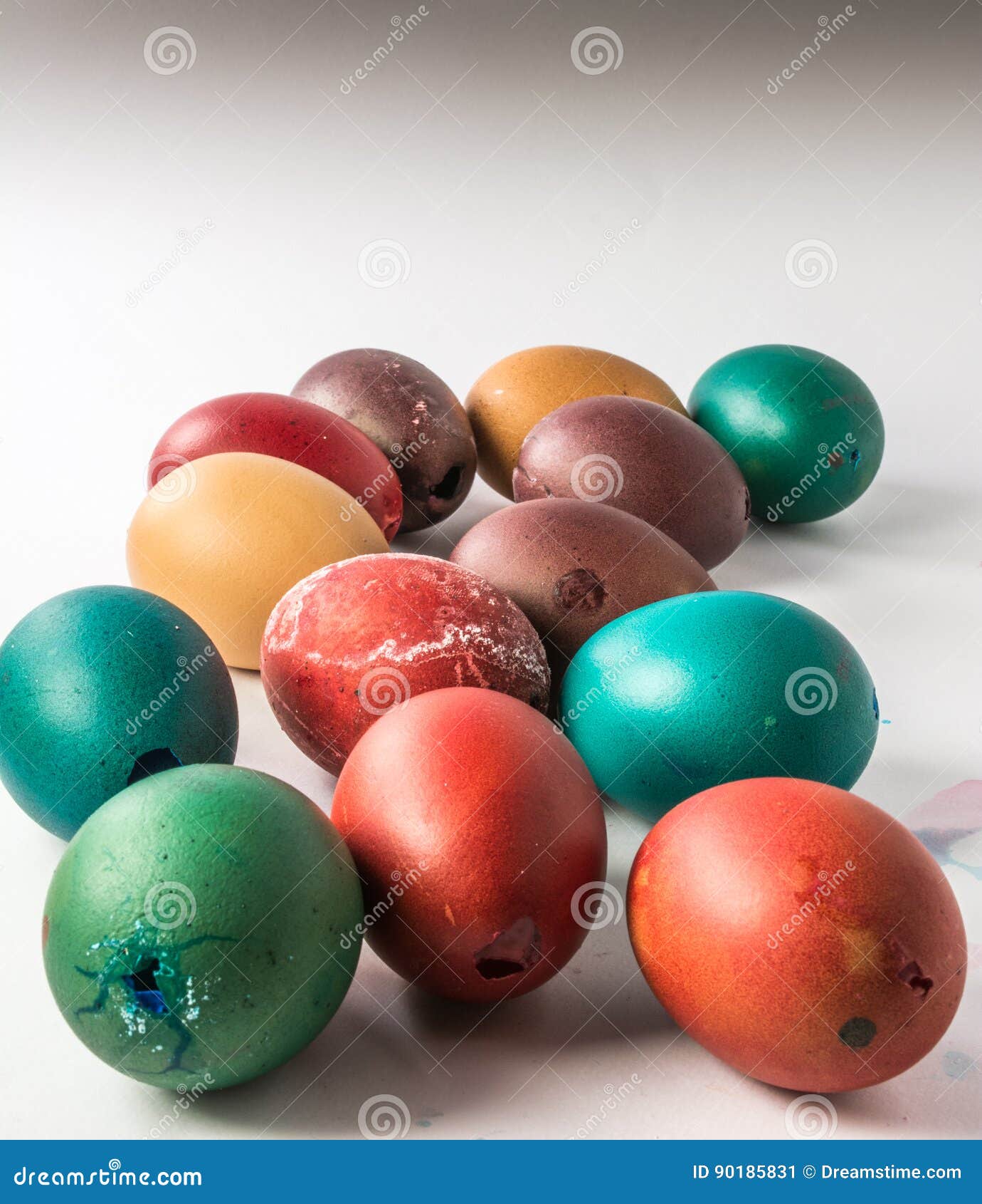 group of dyed easter eggshells on an white bacground