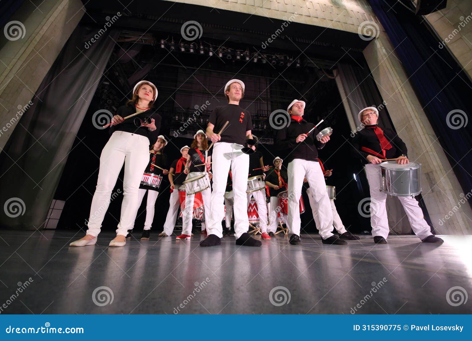 a group of eleven people in the same costumes