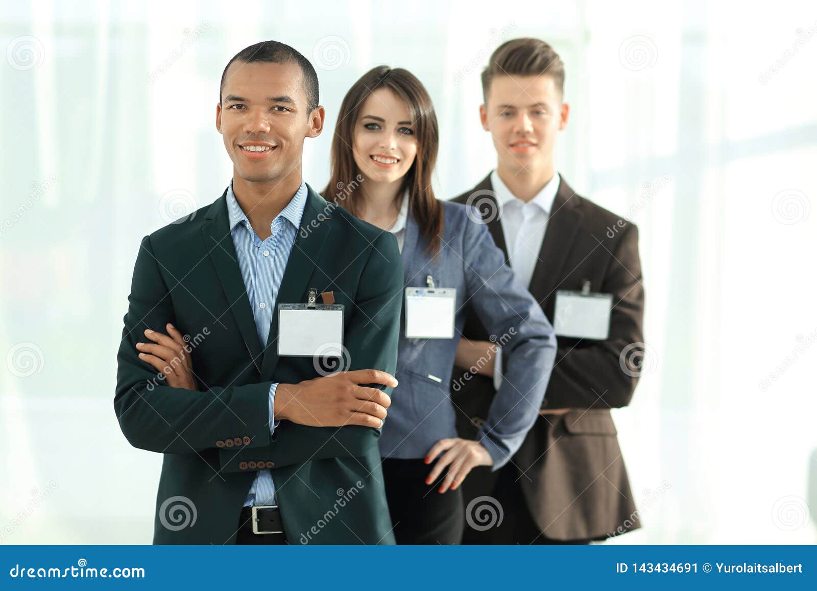 Group of Employees with Blank Badges, Standing Up for Each Other. Stock