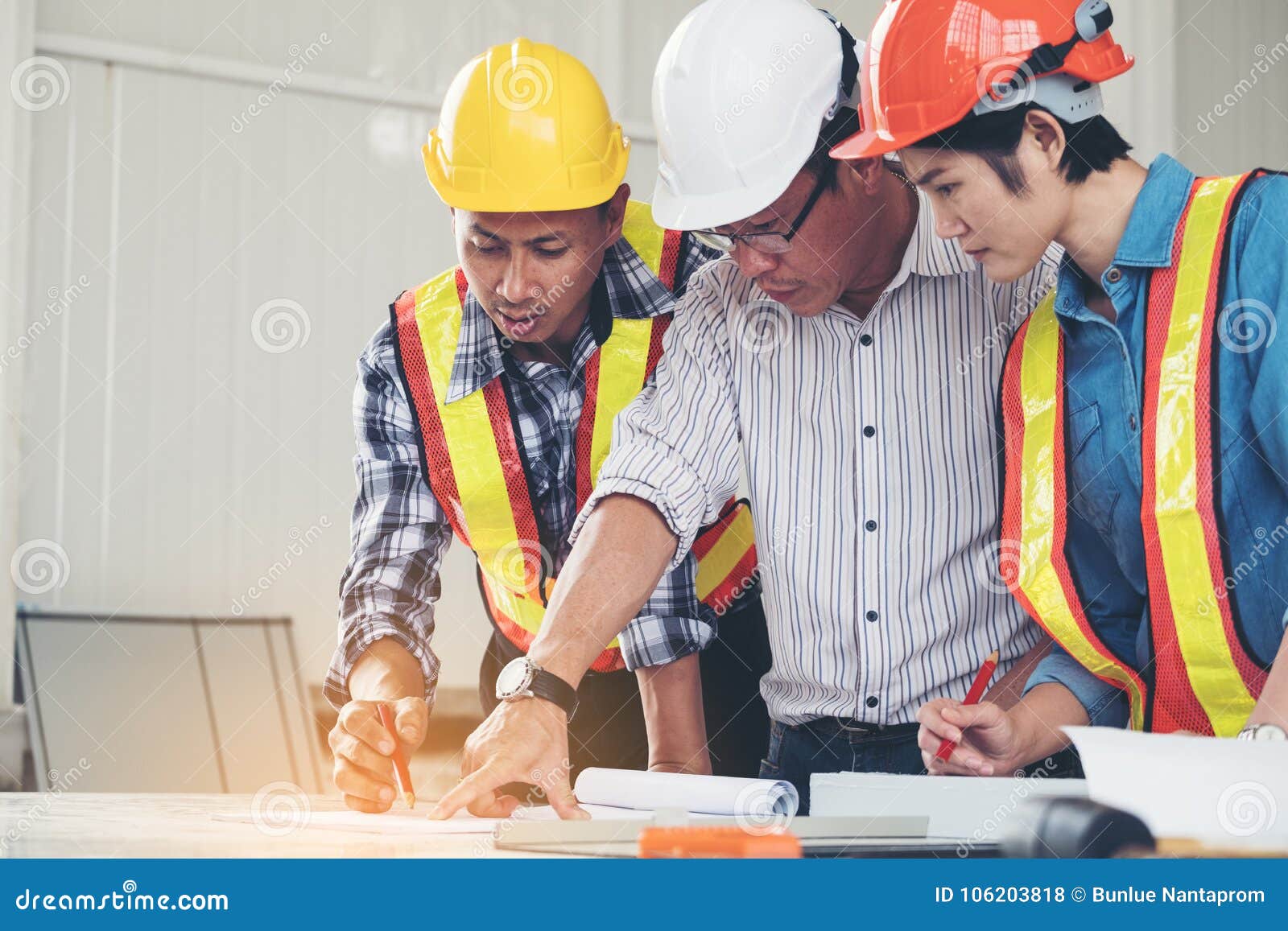 Group Engineers and Architects are Discussing the Construction. Stock Photo Image of
