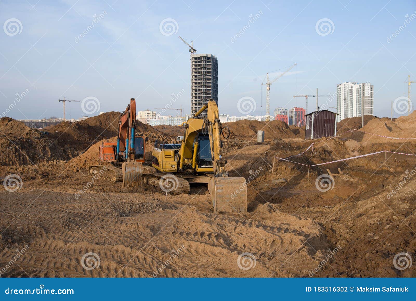 Group of the Excavators for Dig Ground Trenching at a Construction Site