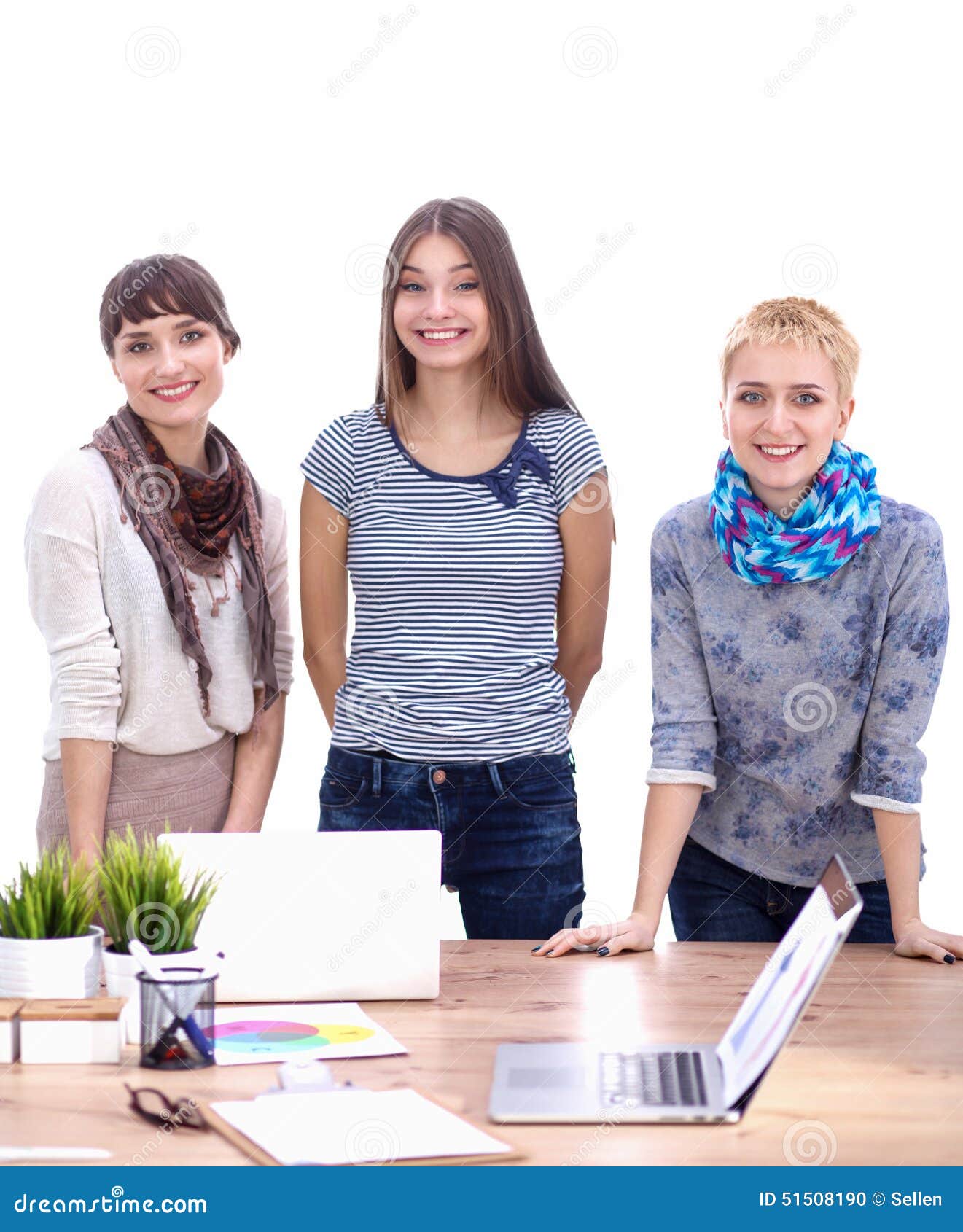 Group Of Fashion Designers Discussing Designs In A Stock Photo - Image