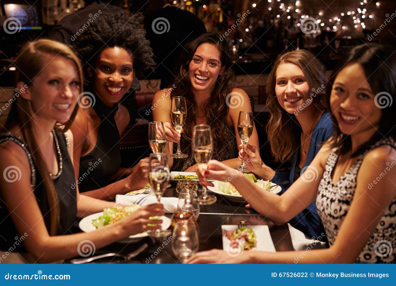 Group of Female Friends Enjoying Meal in Restaurant Stock Photo - Image