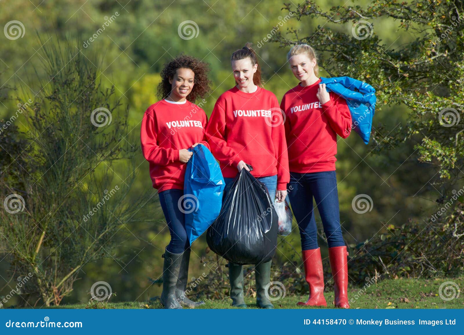 group of female volunteers collecting litter