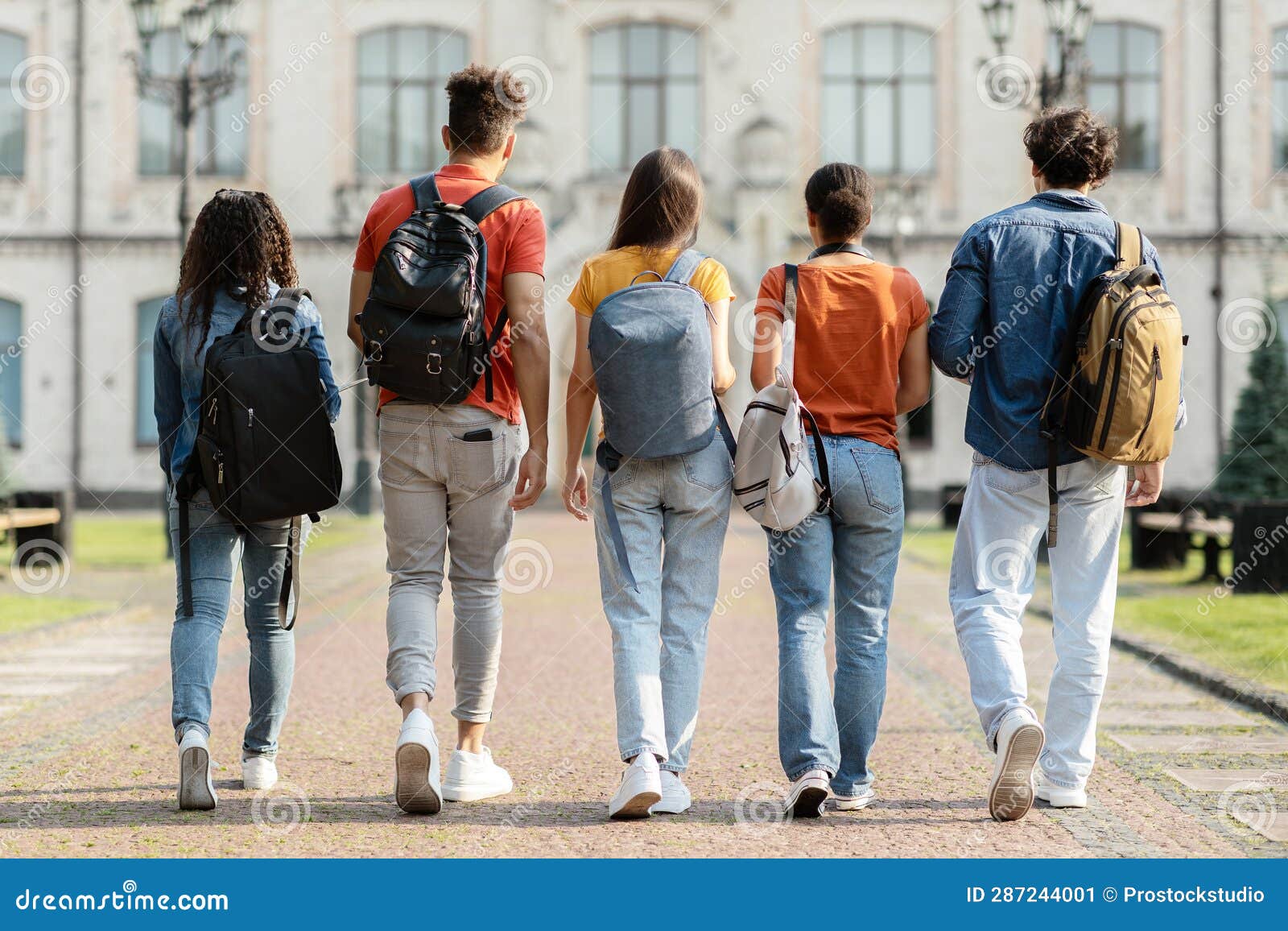 Group of Five Students with Backpacks Walking at University Campus