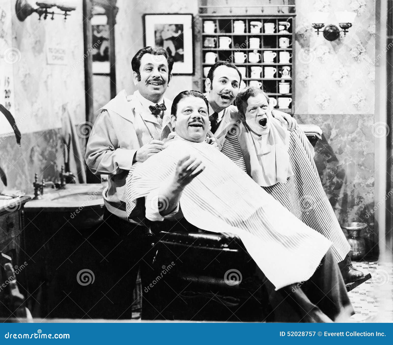 group of four men at a barber shop singing