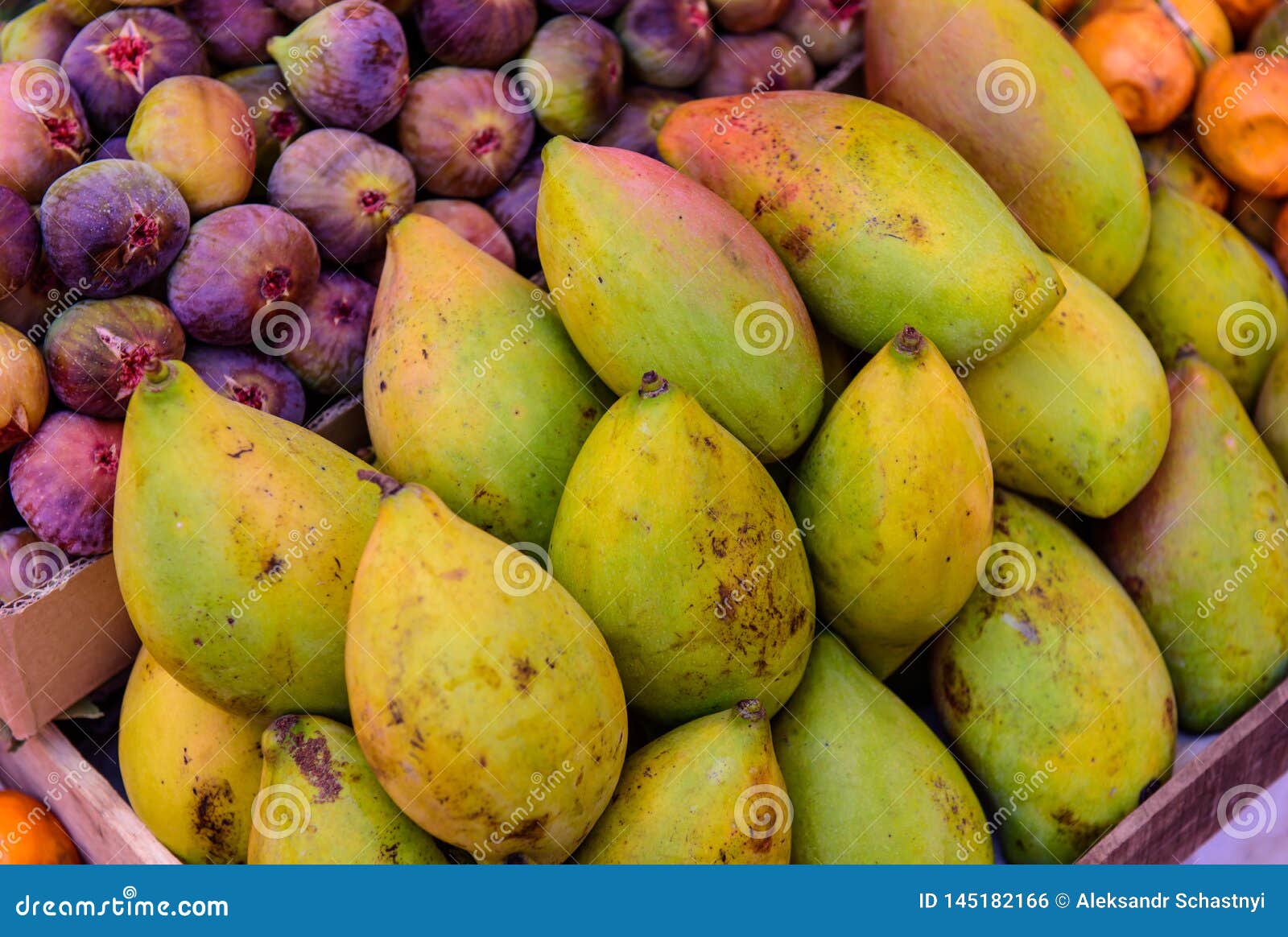 group of fresh mango and figs