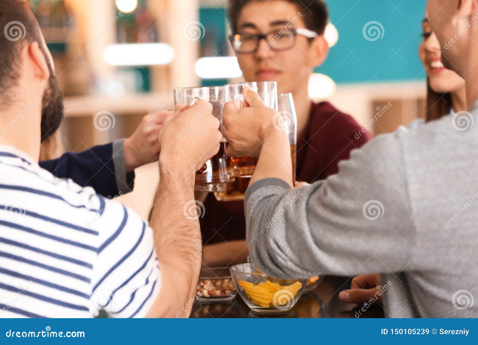 Group of Friends Clinking Glasses with Beer in Bar Stock Image Image