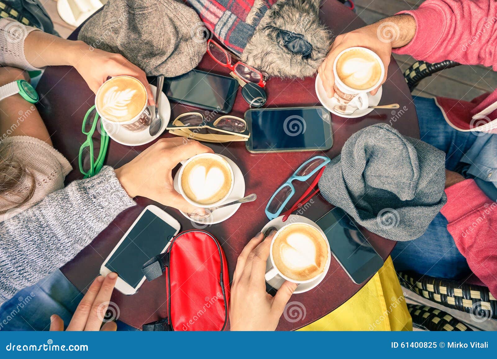 group of friends drinking cappuccino at coffee bar restaurants