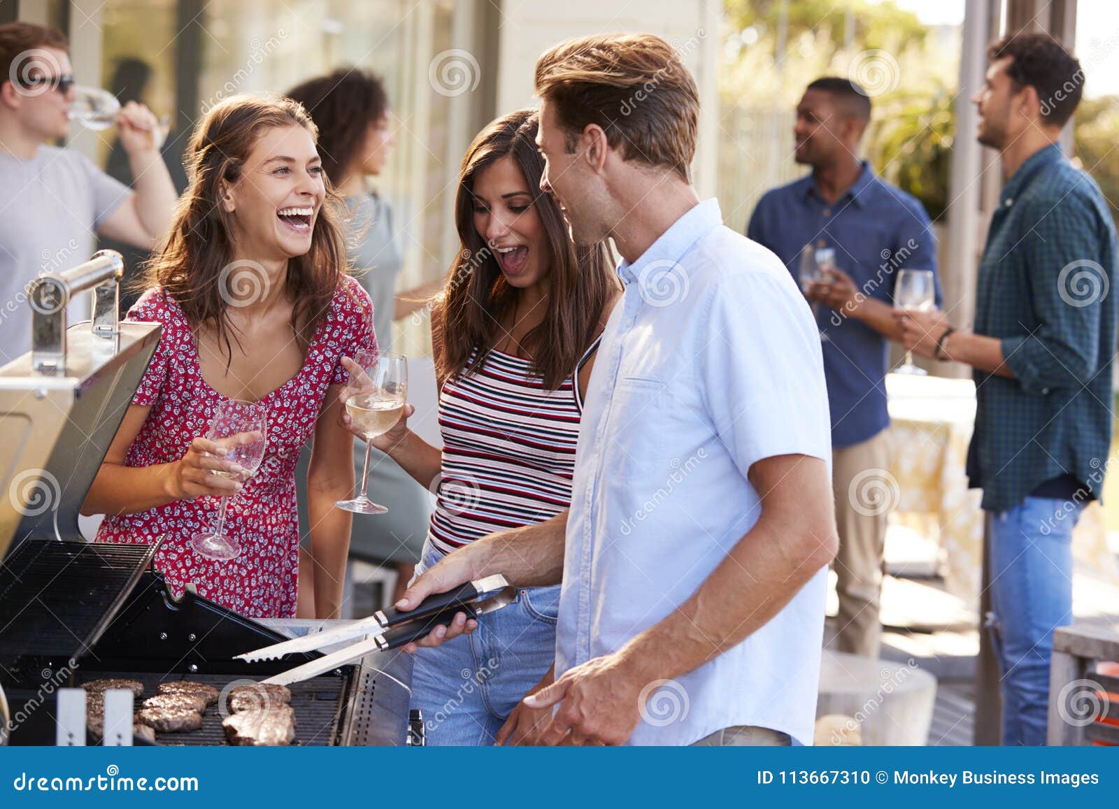 group of friends enjoying barbecue at home together