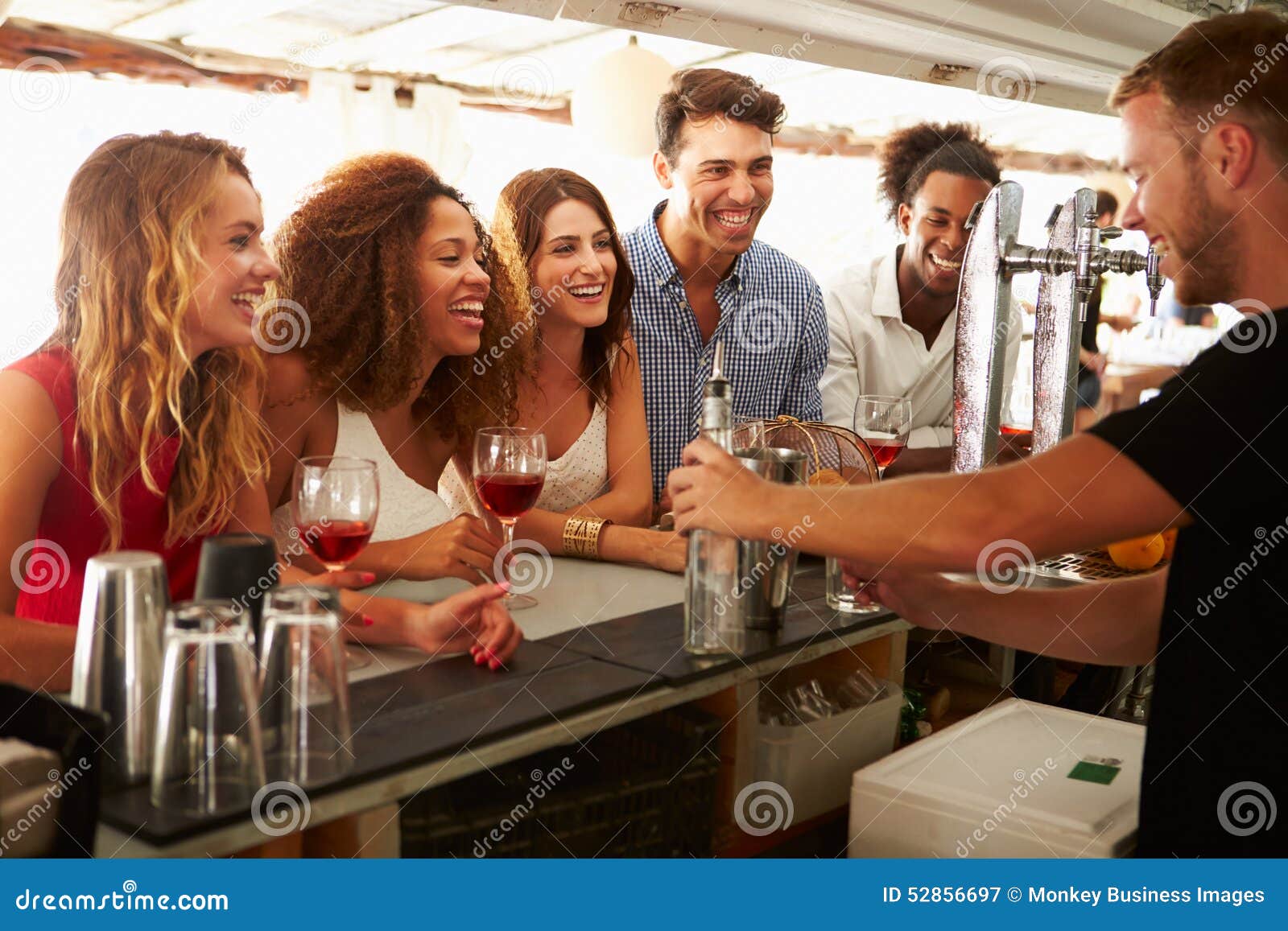 Group of Friends Enjoying Drink at Outdoor Bar Stock Image Image of