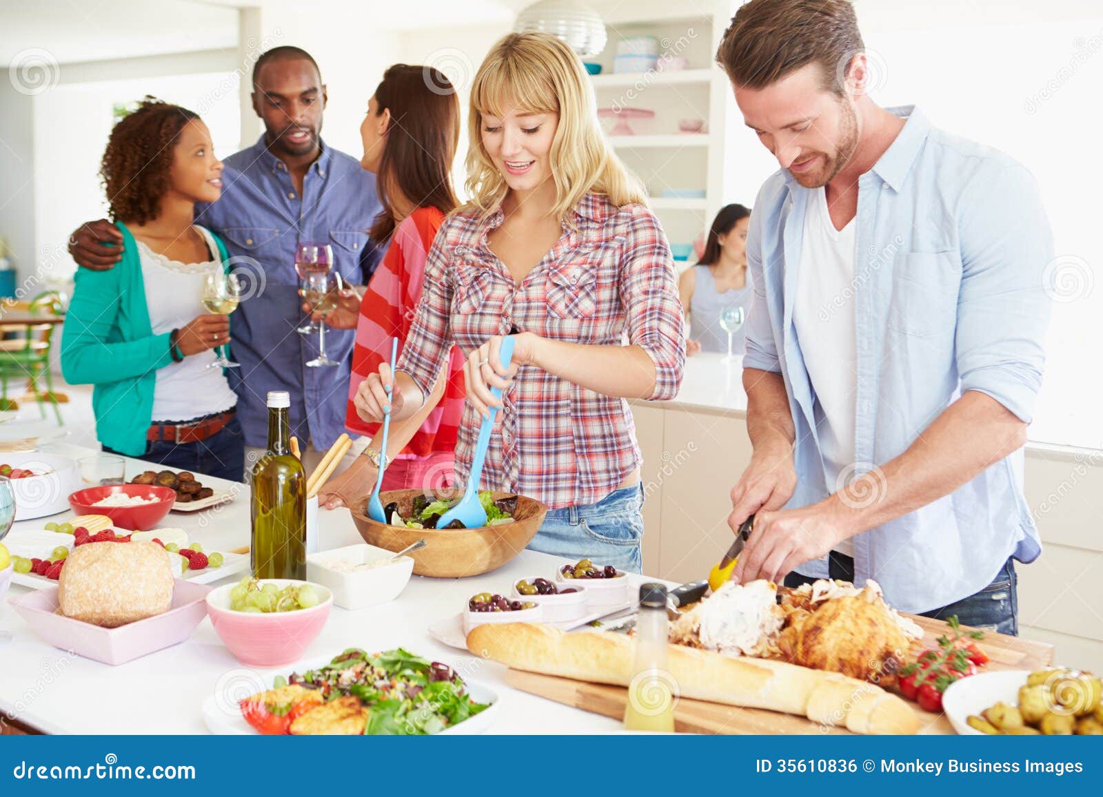 group of friends having dinner party at home