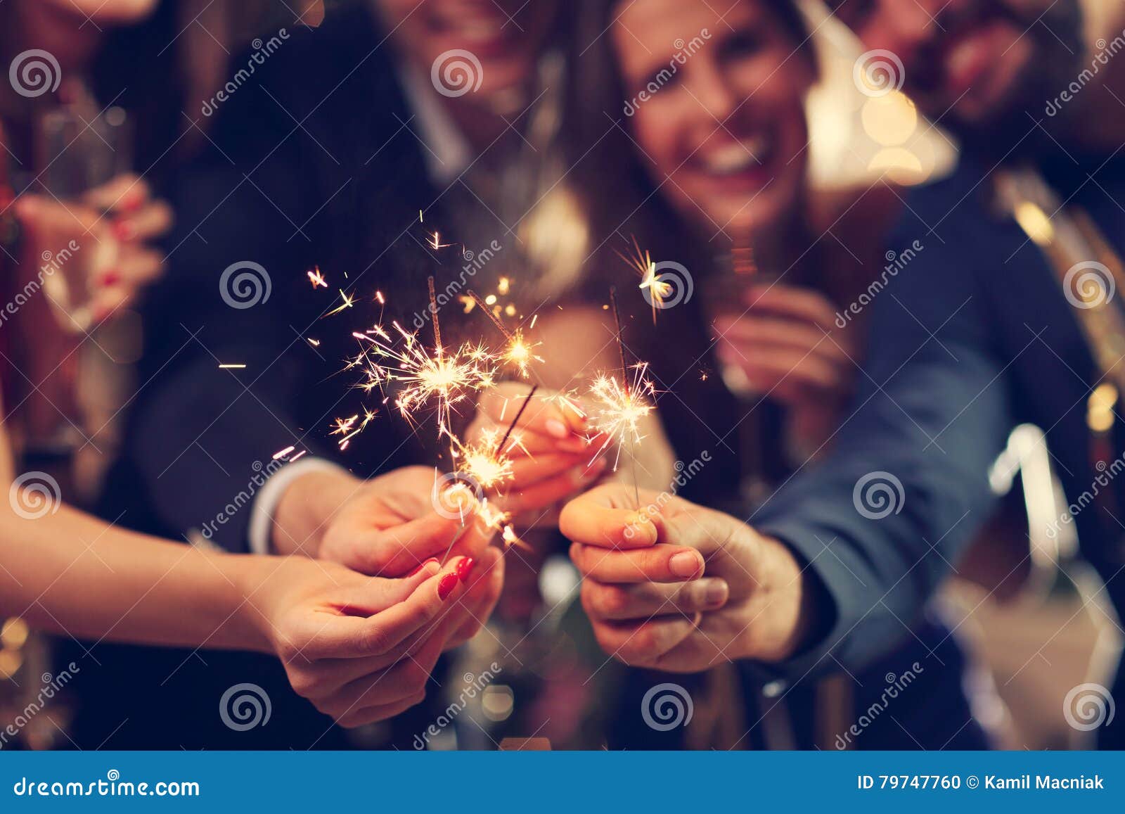 group of friends having fun with sparklers