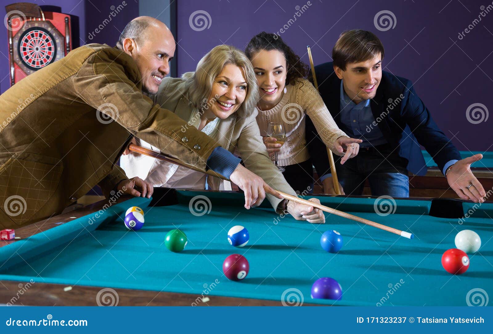 Friends play billiards., Stock image