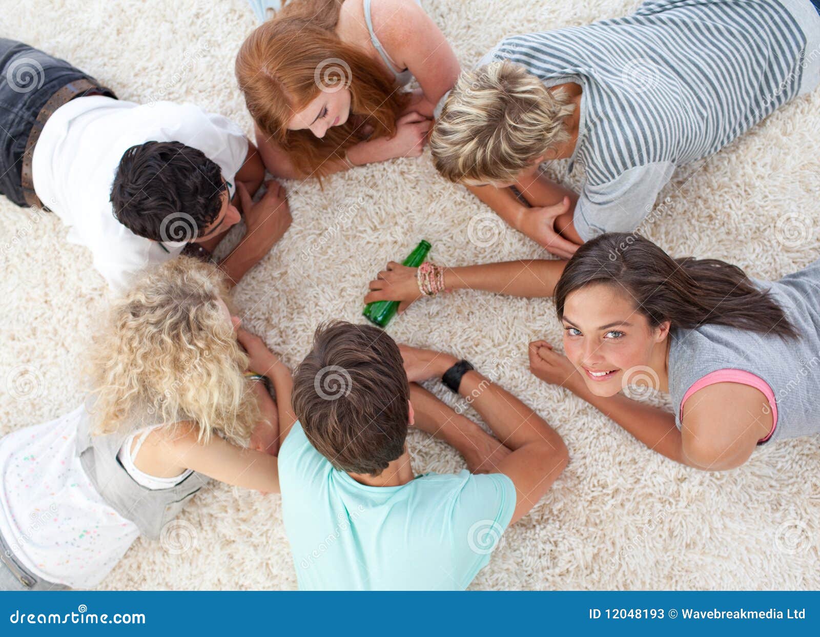 Group Of Friends Playing Spin The Bottle Stock Image Image Of 
