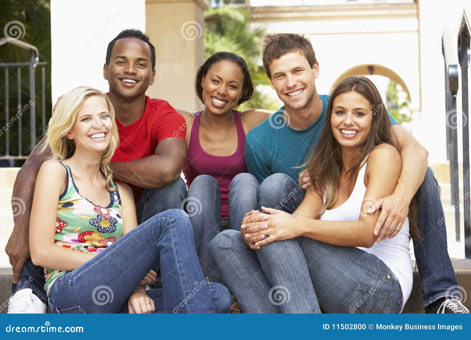 Group of Friends Sitting on Steps of Building Stock Photo - Image of ...