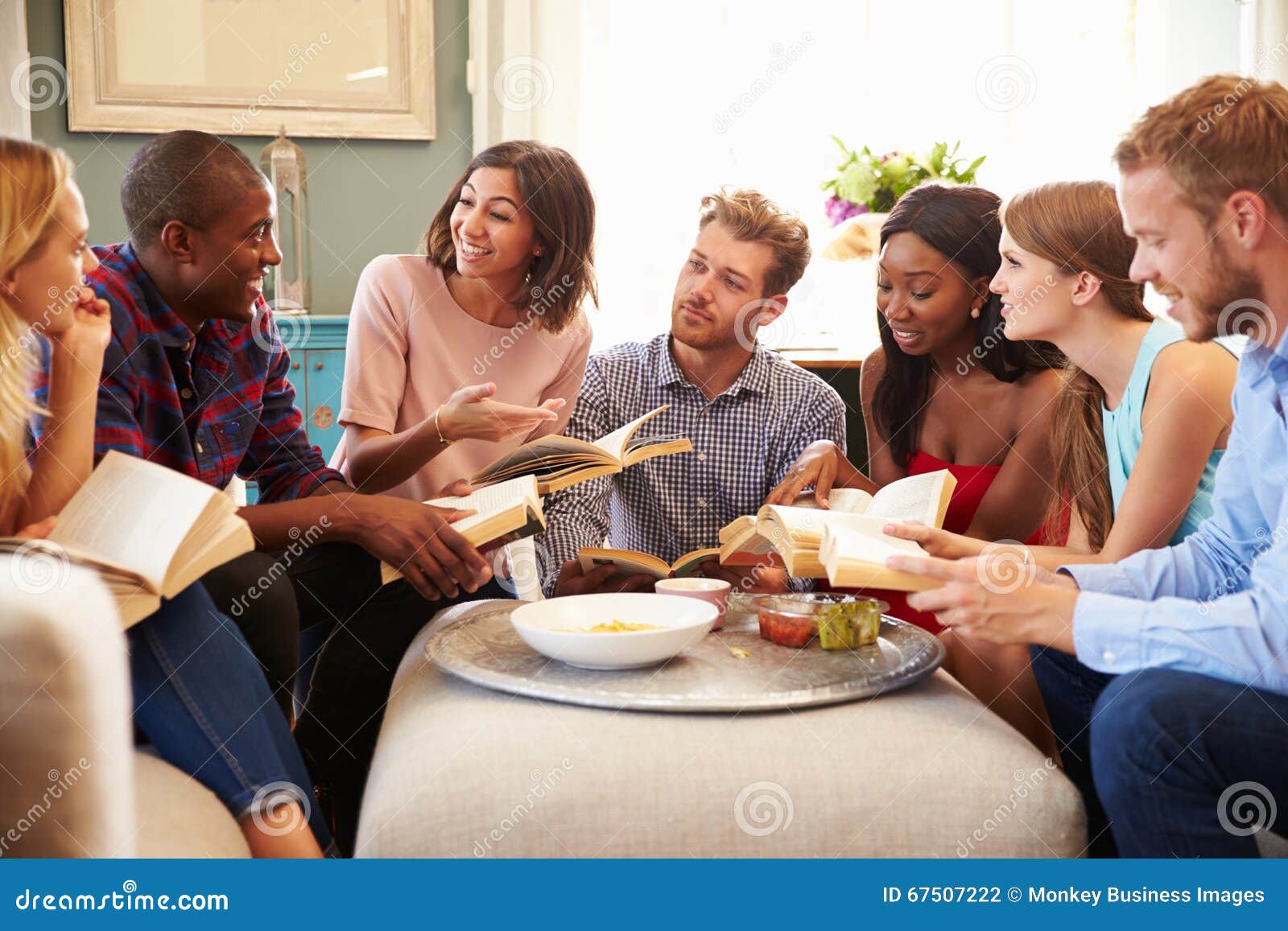 Group Of Friends Taking Part In Book Club At Home Stock Photo Image 67507222
