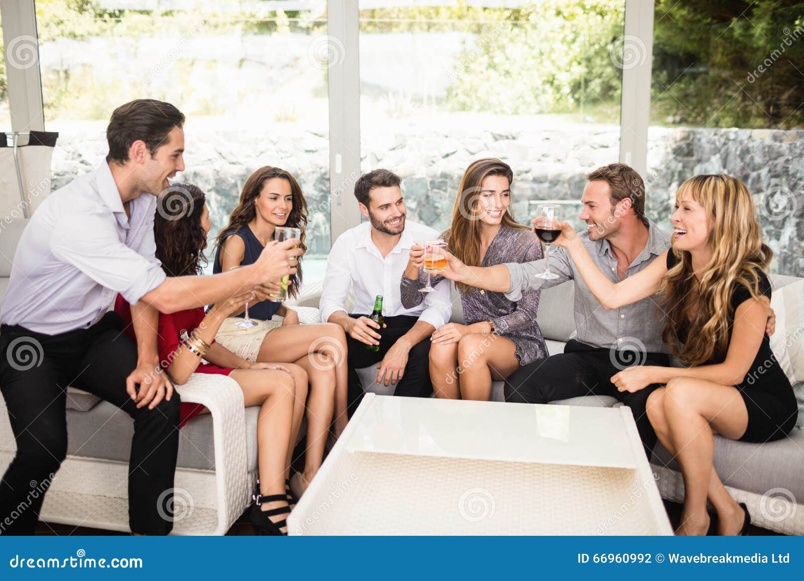Group Of Friends Talking And Having Drinks Stock Photo Image Of