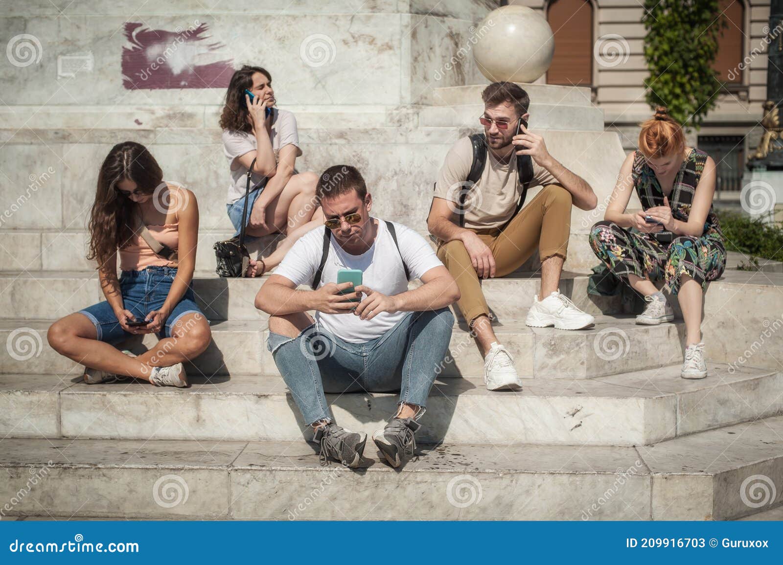 group of friends using smartphones. emotional isolation and technology depresion