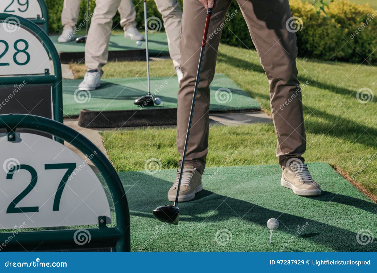 Group of Golf Players Playing Golf Together at Golf Course Stock Image