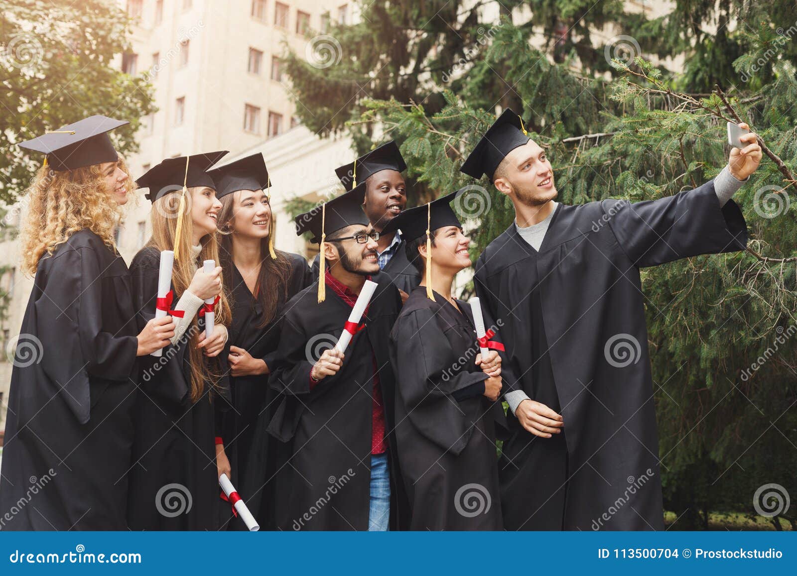 A Group Of Graduates Celebrating Stock Photo Image Of Grad Graduated