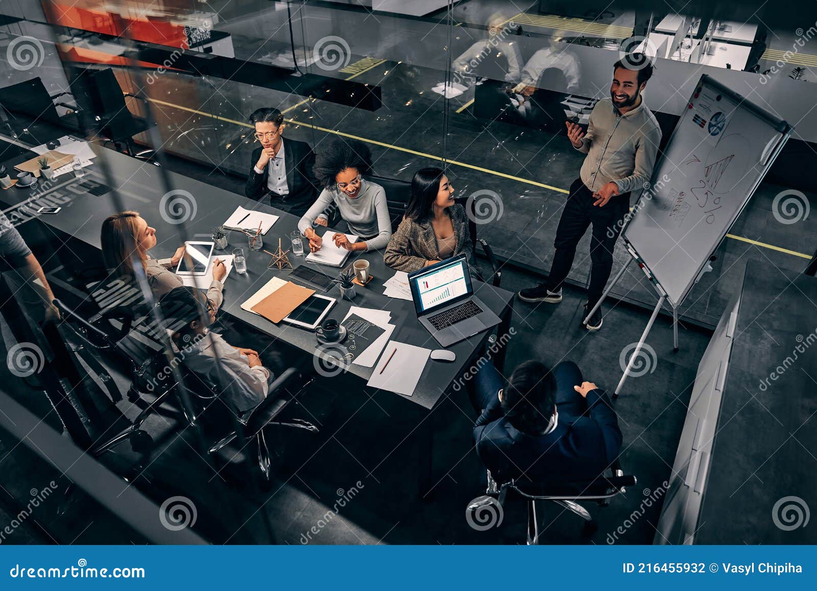 a group of handsome business people working in a spacious conference room in a large business center. concept of startup, projects