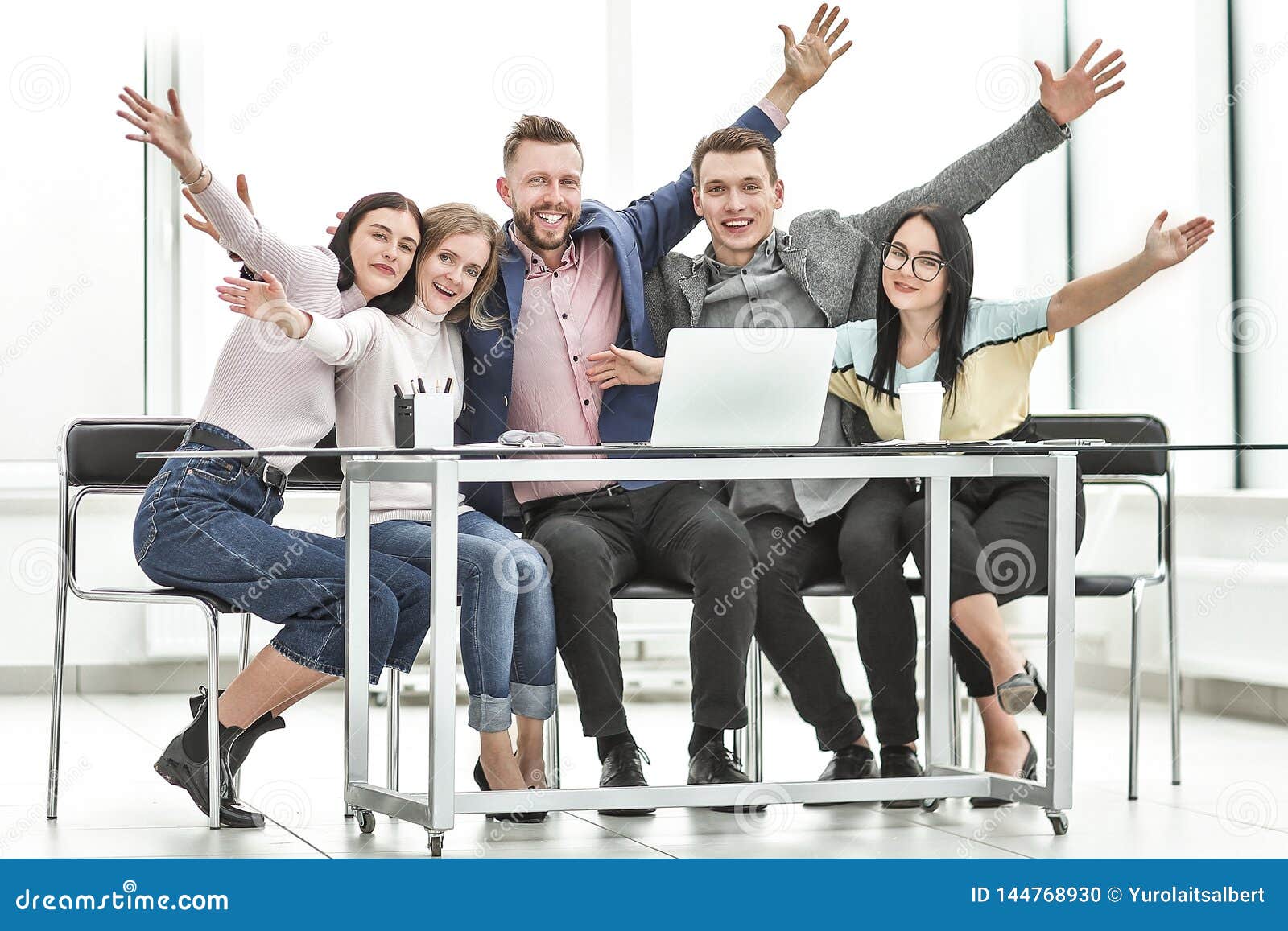 Group of Happy Employees Sitting at the Desk. Stock Photo Image of