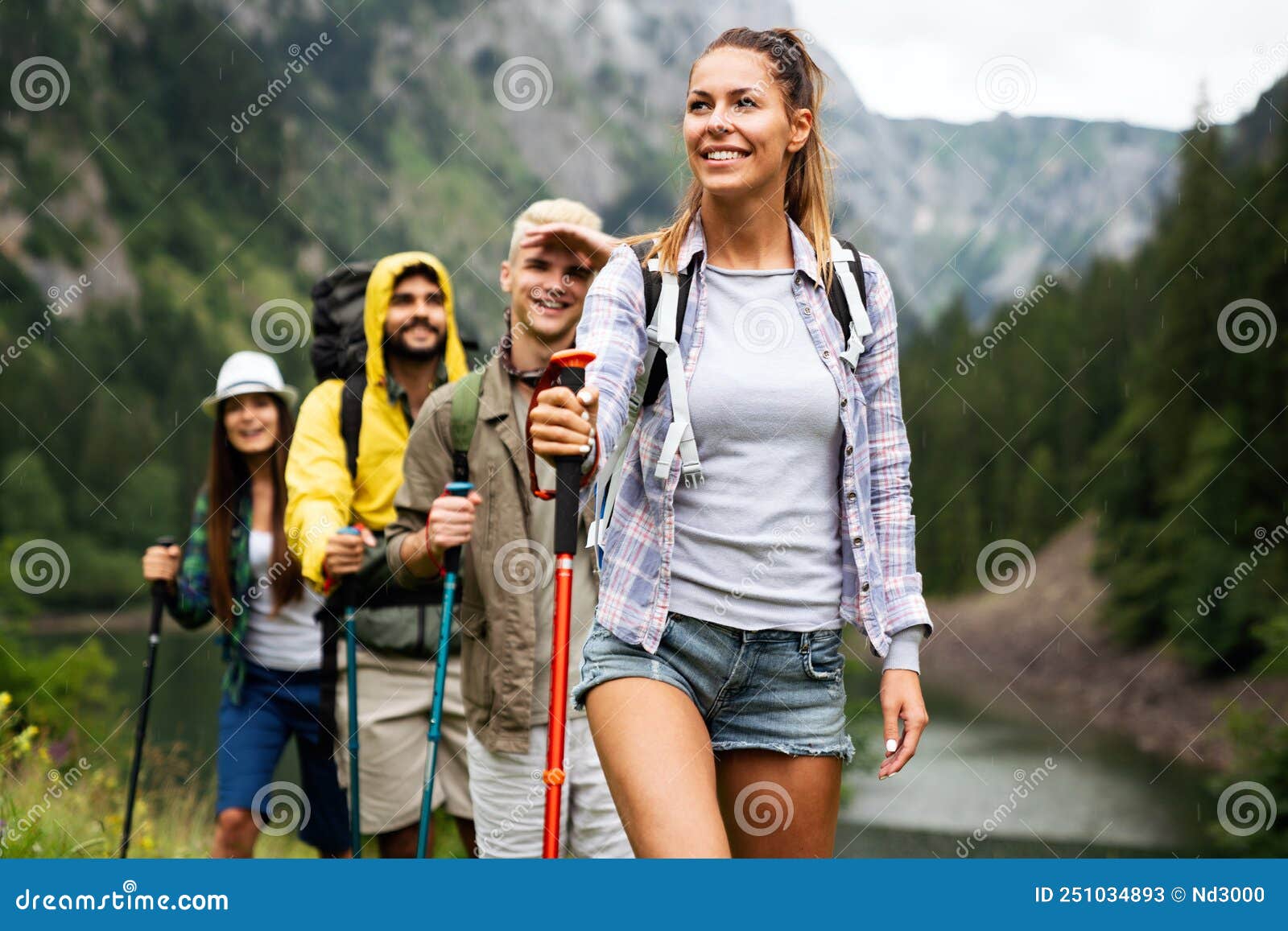 Group Of Happy Fit Friends Hiking Trekking Together Outdoor Nature