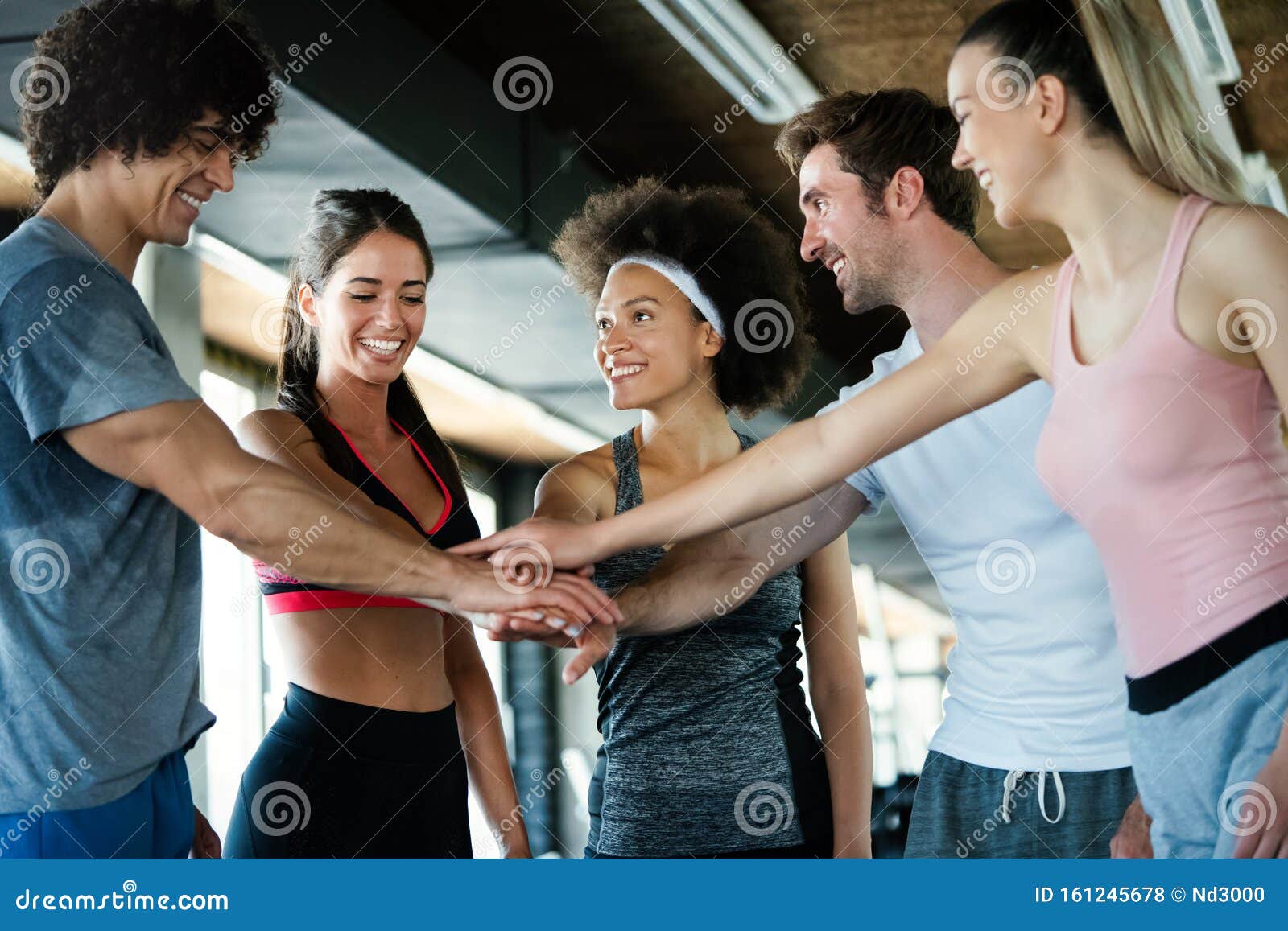 Group of Happy Multiracial Friends Exercising Together in Gym Stock ...