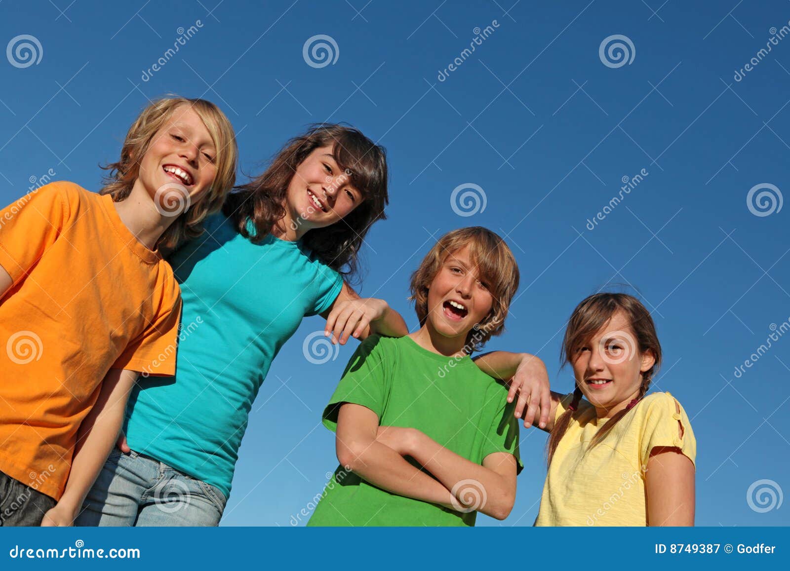 group of happy smiling kids or tweens