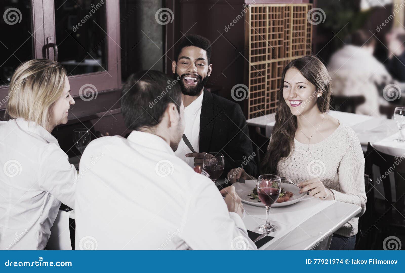 Group Having Dinner in Restauran Stock Photo - Image of female, indoors