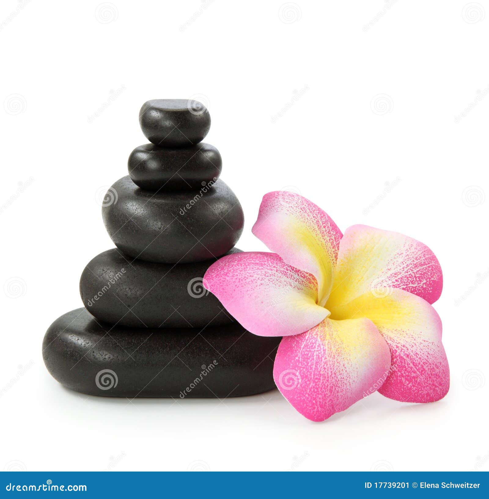 group of hot stones and flower