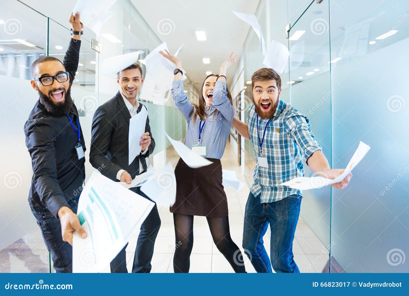 group of joyful excited business people having fun in office