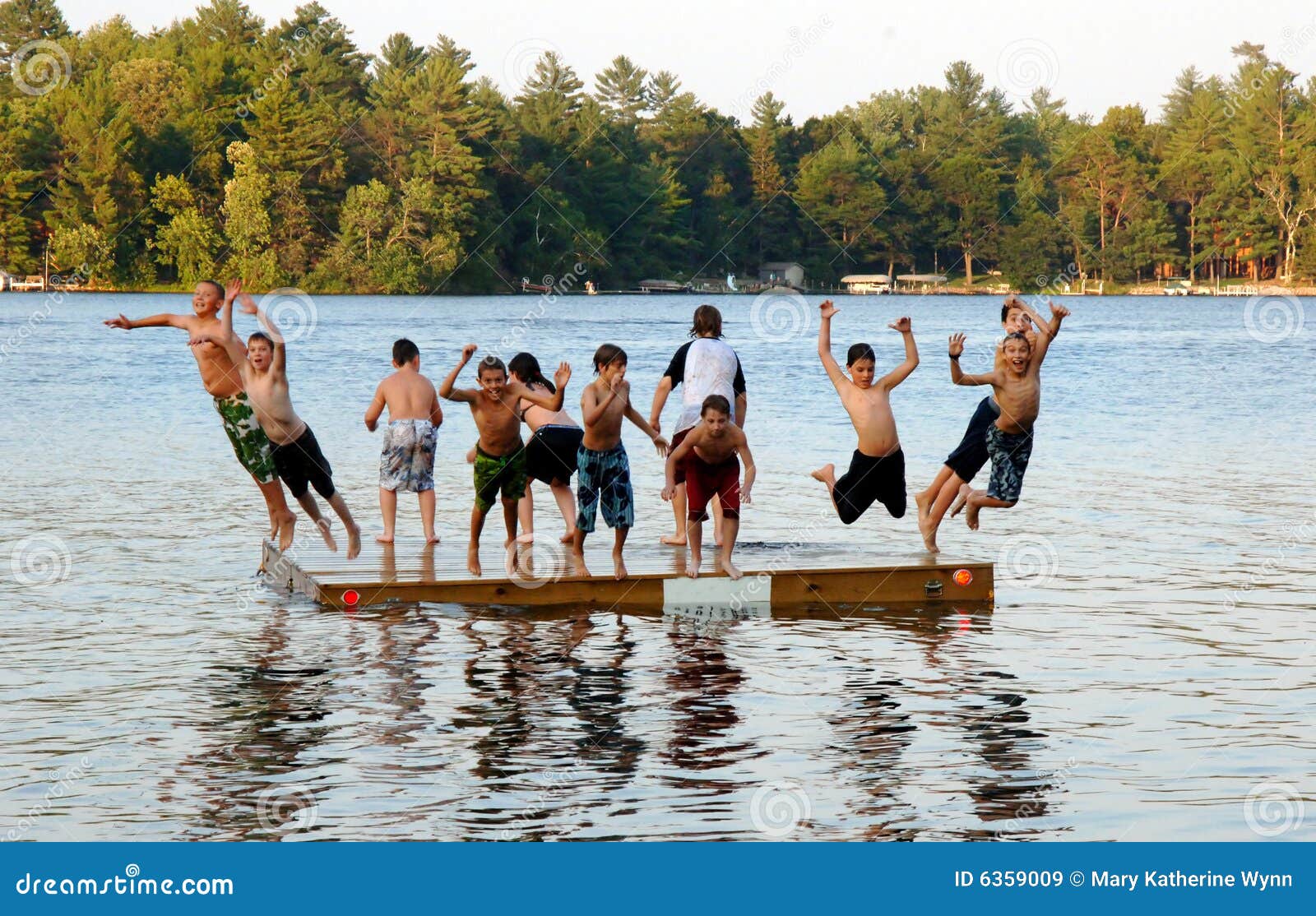Group of kids jump into Lake