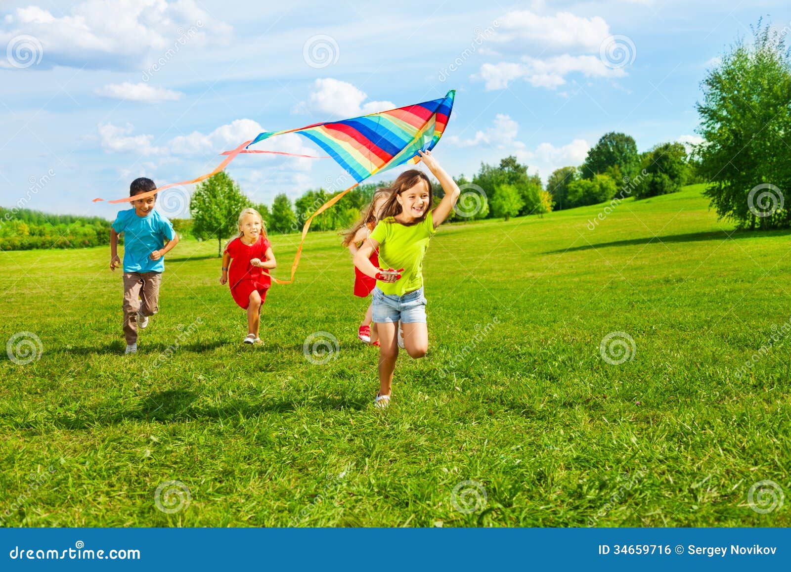 group of kids with kite