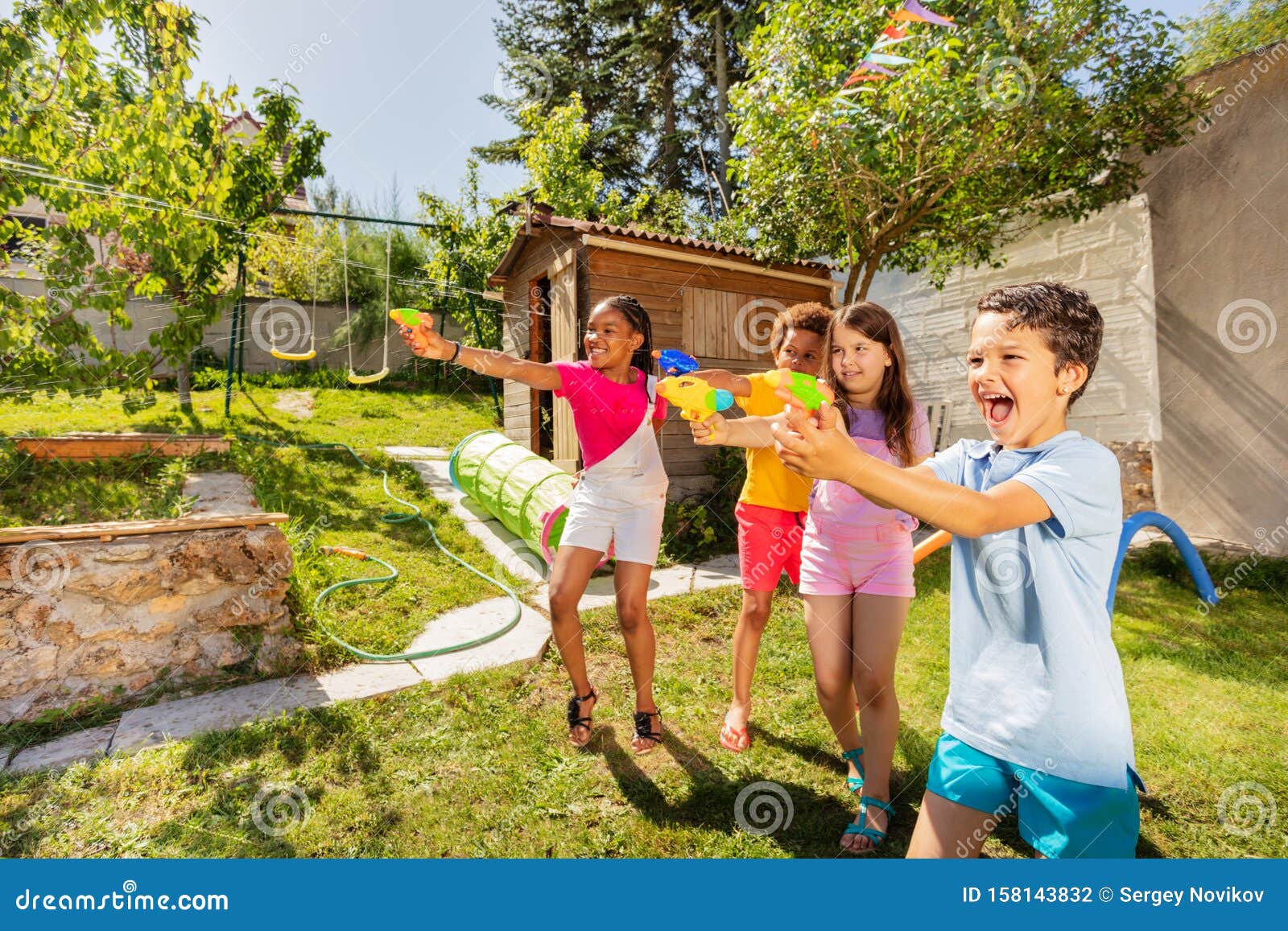 Kids Play Water Gun Fight In A Team With Friends Stock Photo Image Of