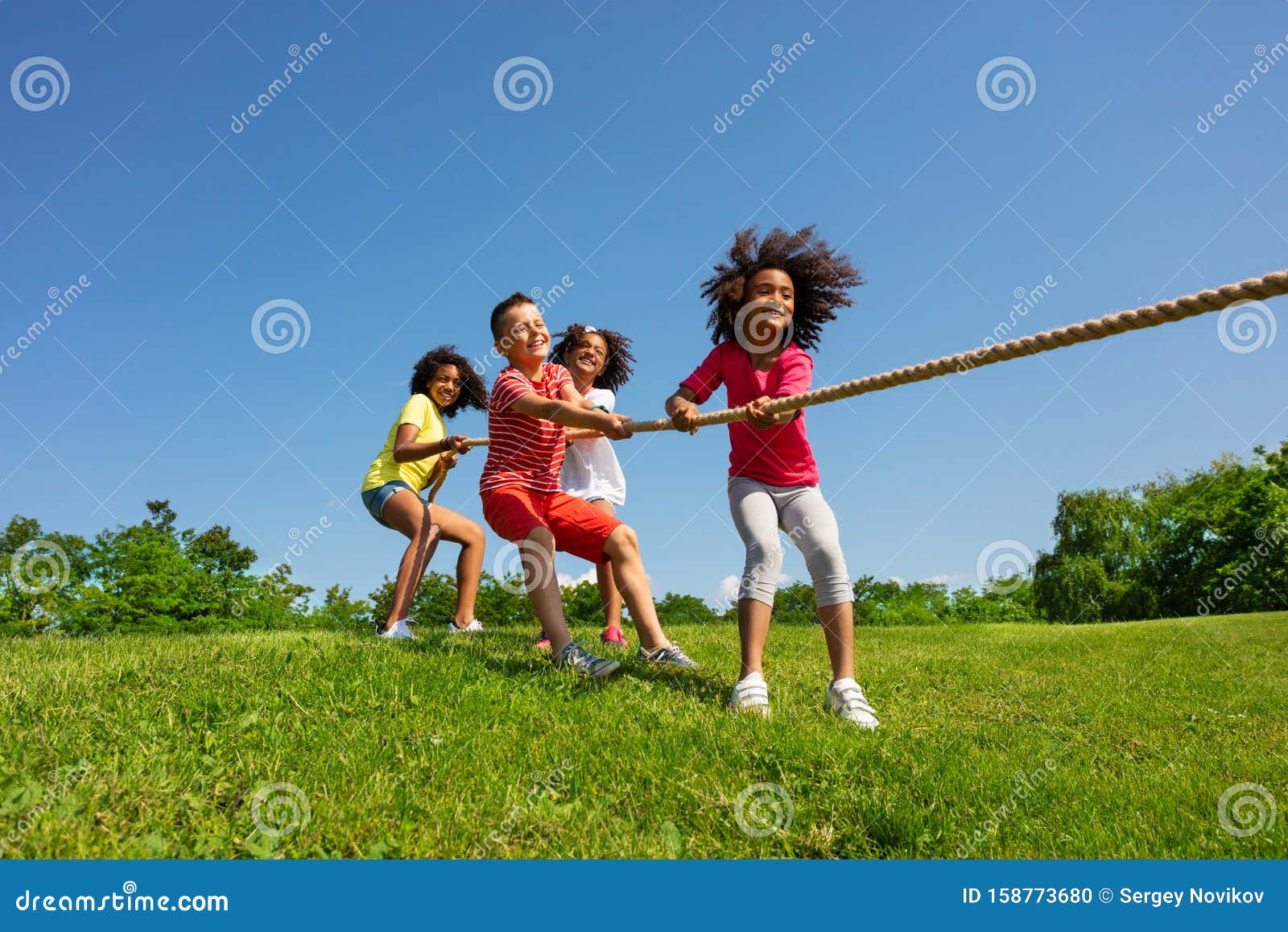 Kids Pull Rope - a Competitive Fun Game in Park Stock Photo - Image of  kids, friends: 158773680