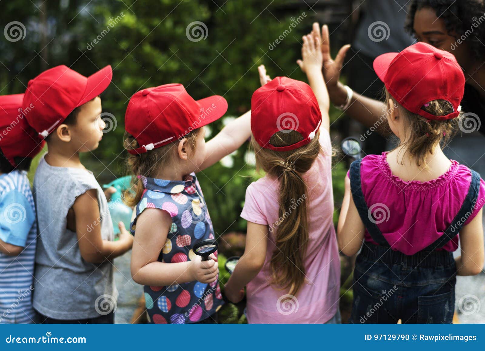 group of kids school field trips learning outdoors active smiling fun