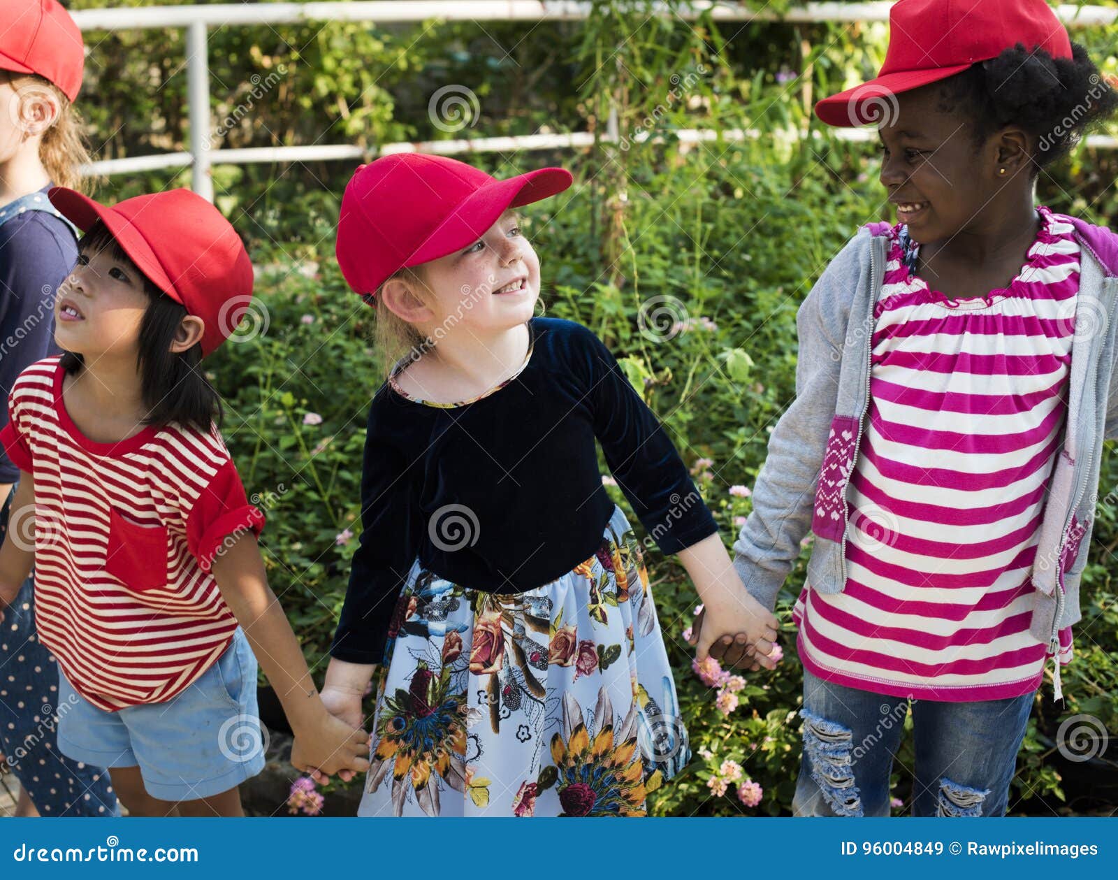 group of kids school field trips learning outdoors botanic park