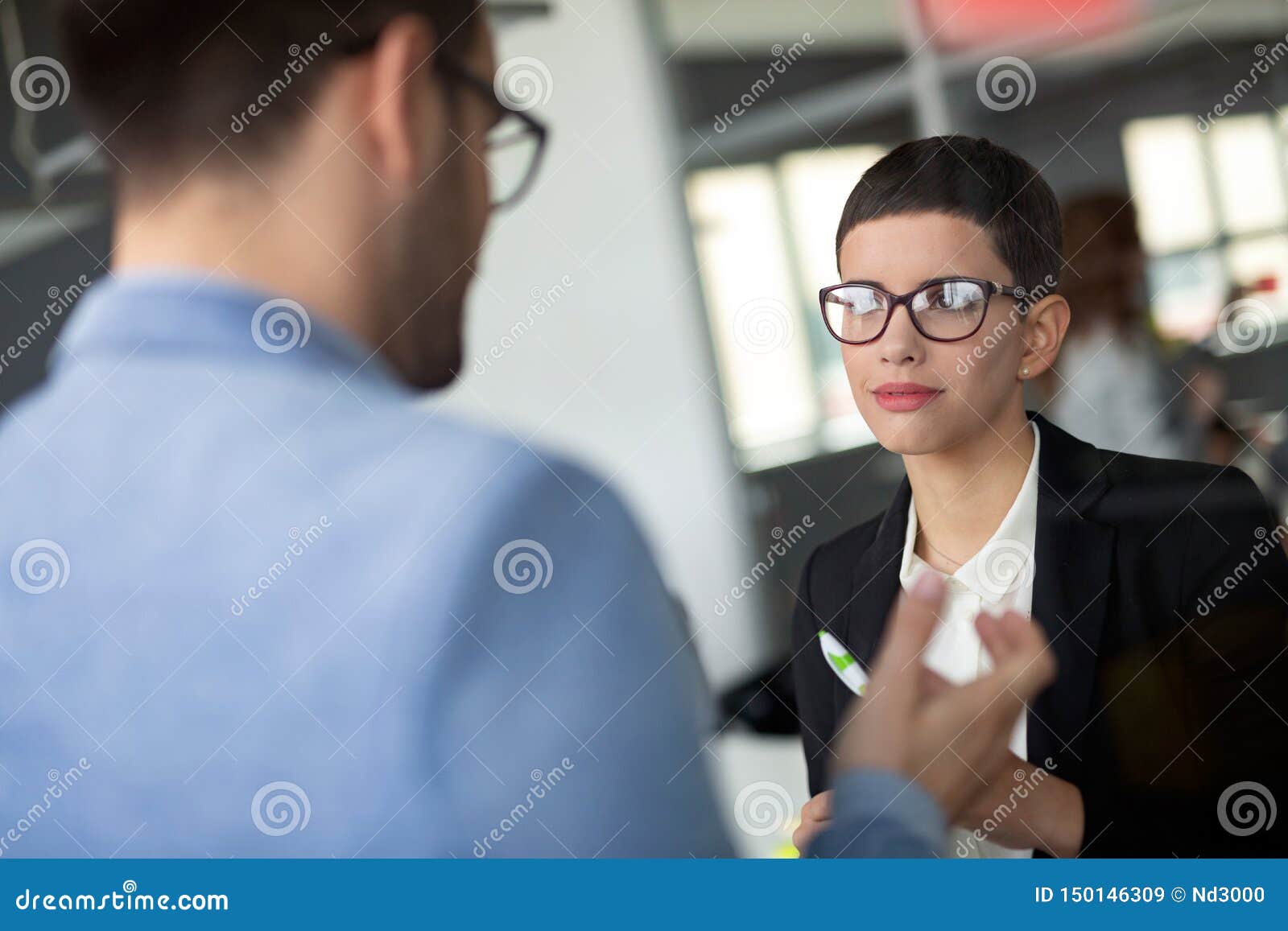 Group of Lawyers Discussing Contract Together in Office Stock Image